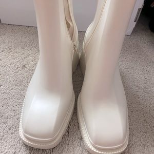 New, never worn, square shaped rain boots size 10. Cut small.